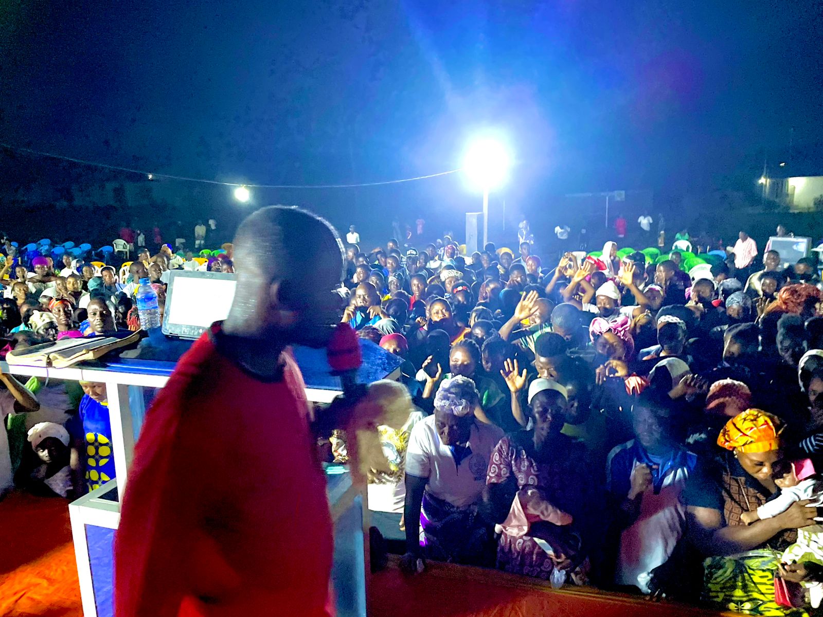 Crusade crowd taking part in worship together